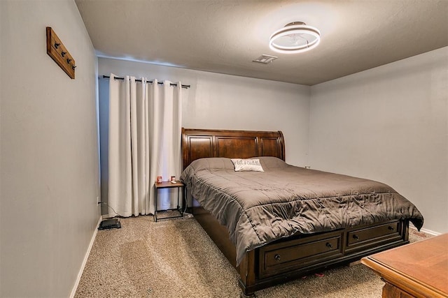 bedroom with visible vents, baseboards, and carpet