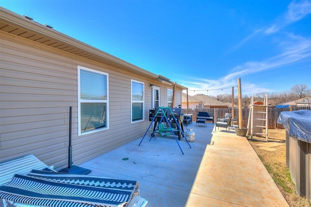 view of patio / terrace featuring an outdoor hangout area and fence