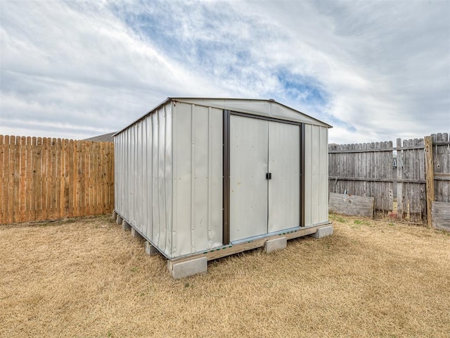 view of shed featuring a fenced backyard