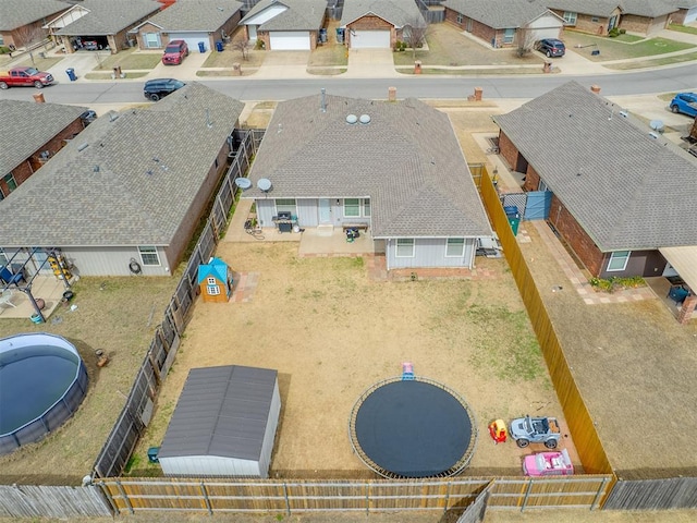 birds eye view of property with a residential view