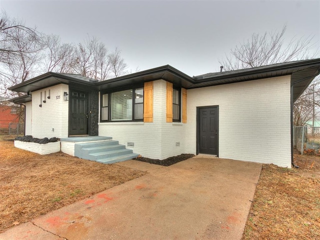 view of front of home with brick siding