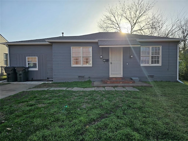 view of front of house with crawl space and a front lawn