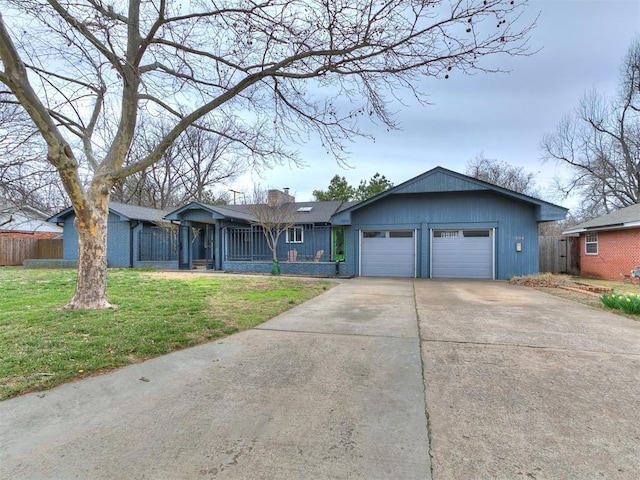 ranch-style house featuring a front lawn, driveway, fence, a garage, and a chimney