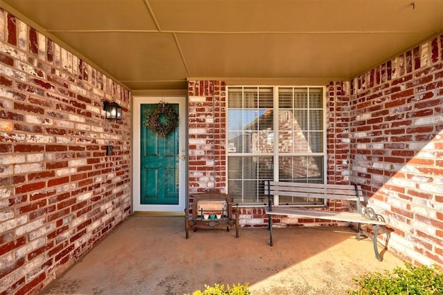 property entrance with brick siding