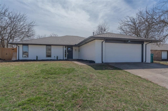 view of front of property with a front yard, an attached garage, brick siding, and driveway