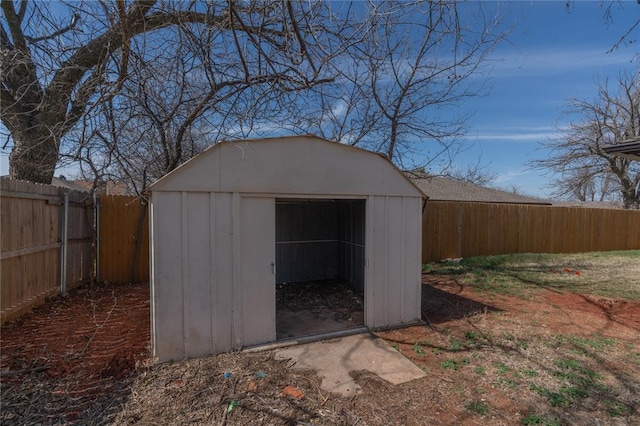 view of shed featuring a fenced backyard