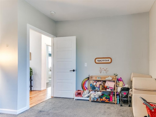 playroom with baseboards and carpet floors