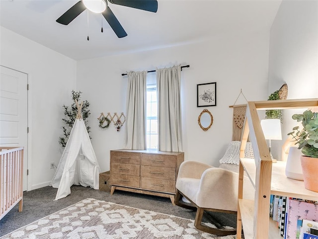 living area featuring carpet flooring and ceiling fan