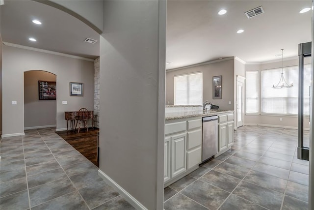 kitchen with arched walkways, visible vents, dishwasher, and crown molding