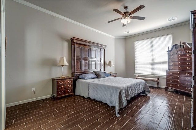 bedroom featuring visible vents, baseboards, crown molding, and wood finish floors