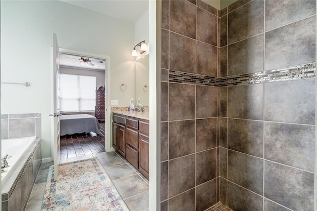 bathroom featuring connected bathroom, ceiling fan, a garden tub, tile patterned floors, and vanity