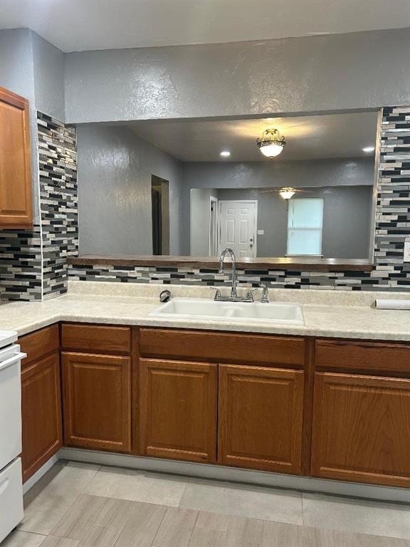 bathroom with decorative backsplash and vanity
