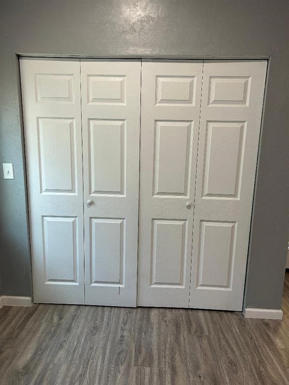 interior details with wood finished floors and baseboards