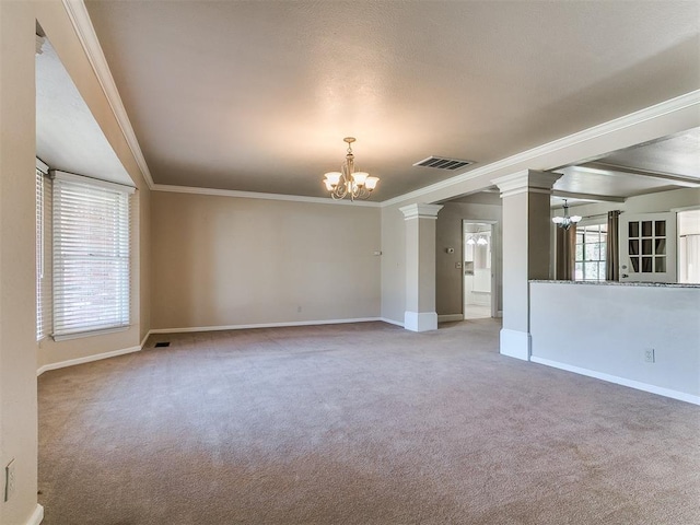 5700 N Billen Ave, Oklahoma City, OK 73112 - carpeted spare room featuring visible vents, a chandelier, and crown molding