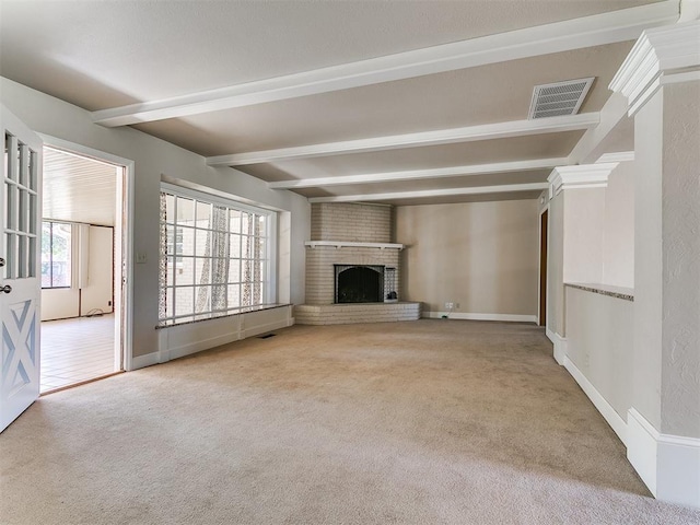 5700 N Billen Ave, Oklahoma City, OK 73112 - unfurnished living room with beamed ceiling, baseboards, visible vents, and carpet floors