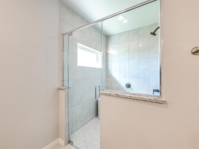 full bath featuring a shower stall