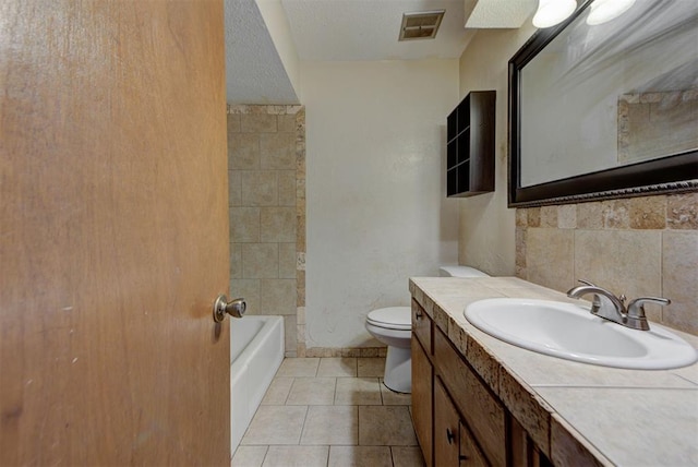 bathroom with vanity, visible vents, tile patterned flooring, toilet, and tasteful backsplash