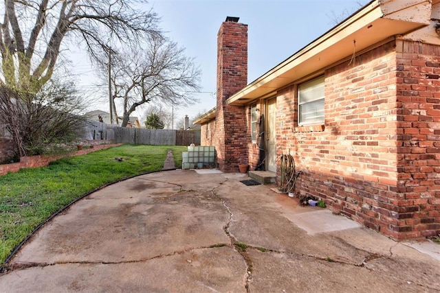 view of patio featuring fence