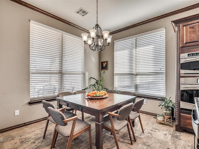 dining space featuring a chandelier, visible vents, crown molding, and baseboards