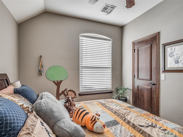 bedroom featuring vaulted ceiling, a ceiling fan, and visible vents