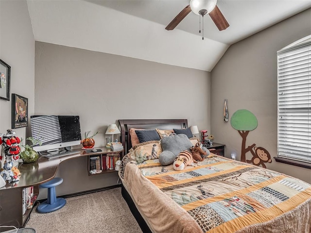 carpeted bedroom featuring vaulted ceiling and ceiling fan