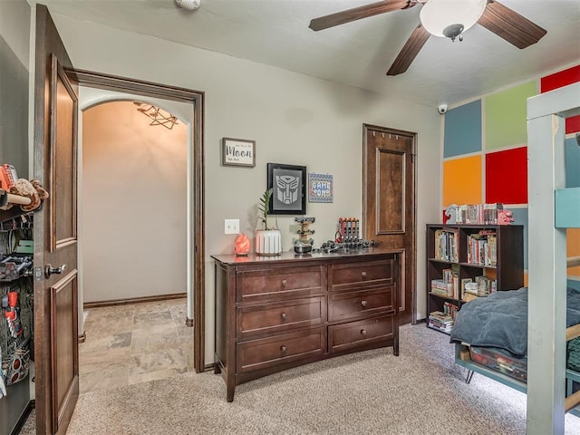 bedroom featuring ceiling fan and light carpet