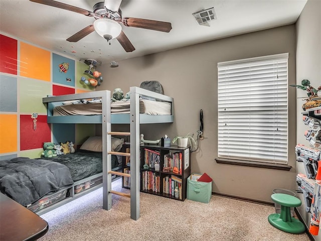 bedroom with visible vents, ceiling fan, and carpet