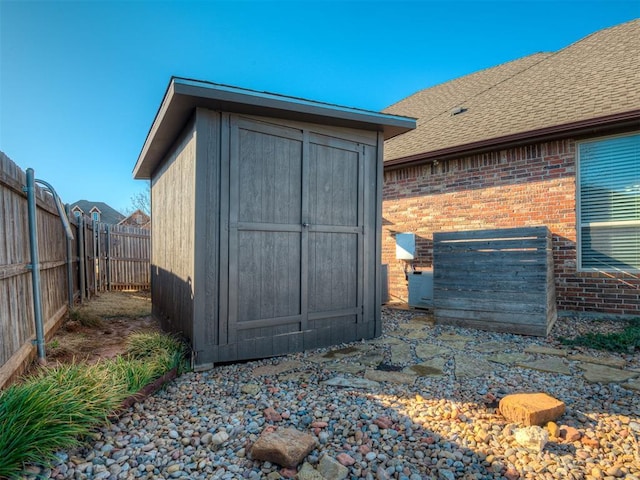 view of shed with a fenced backyard