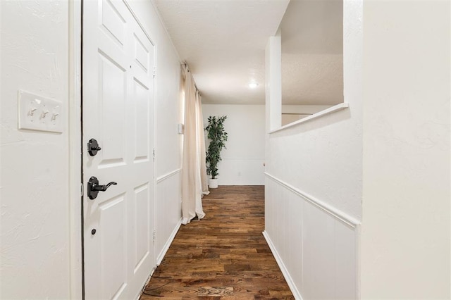 hall featuring dark wood-type flooring