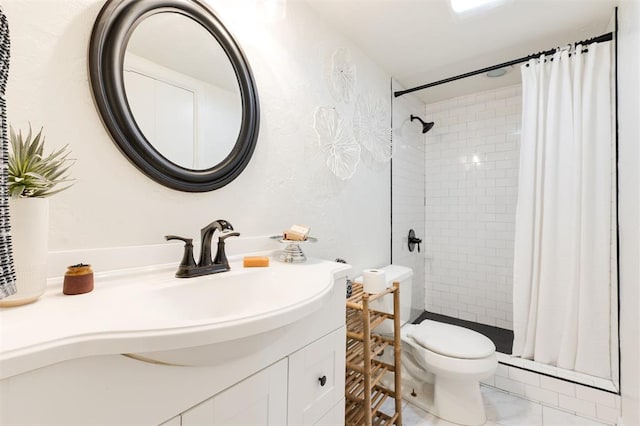 full bathroom featuring vanity, a shower stall, toilet, and marble finish floor