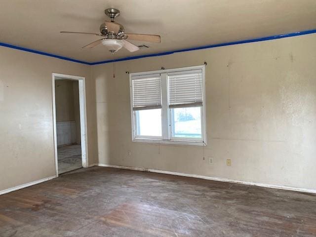 unfurnished room featuring visible vents and ceiling fan