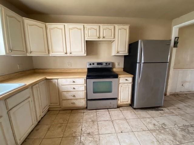 kitchen featuring stainless steel appliances and light countertops