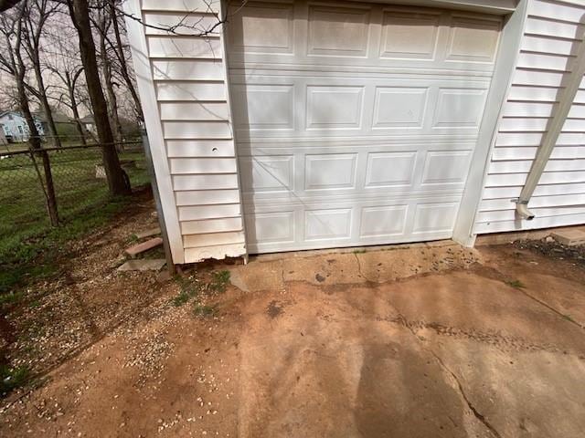 garage with fence