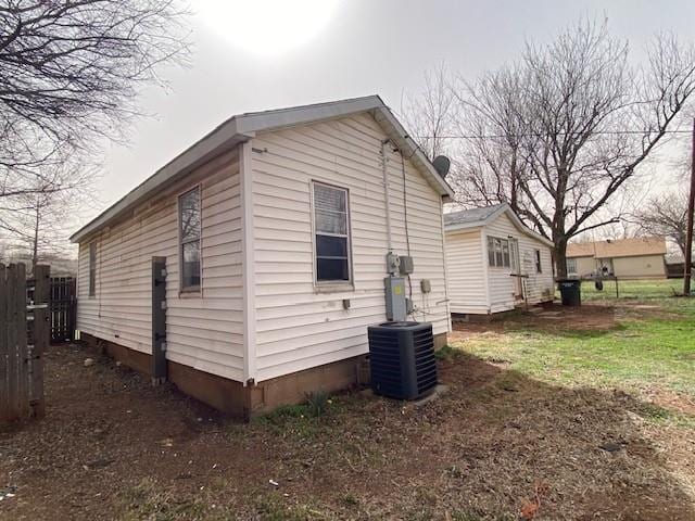 view of side of home featuring central air condition unit