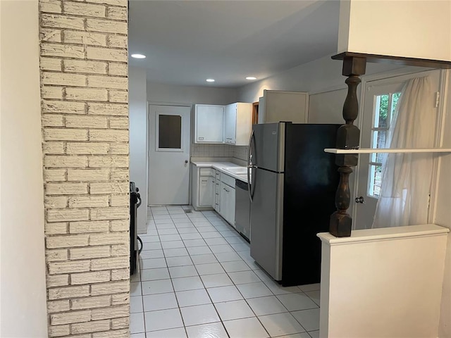 kitchen featuring backsplash, light countertops, light tile patterned floors, recessed lighting, and stainless steel appliances