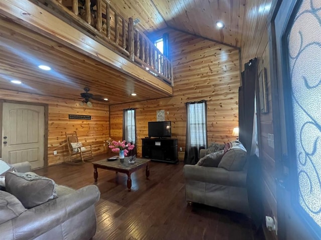 living room with wooden walls, recessed lighting, ceiling fan, hardwood / wood-style flooring, and wooden ceiling