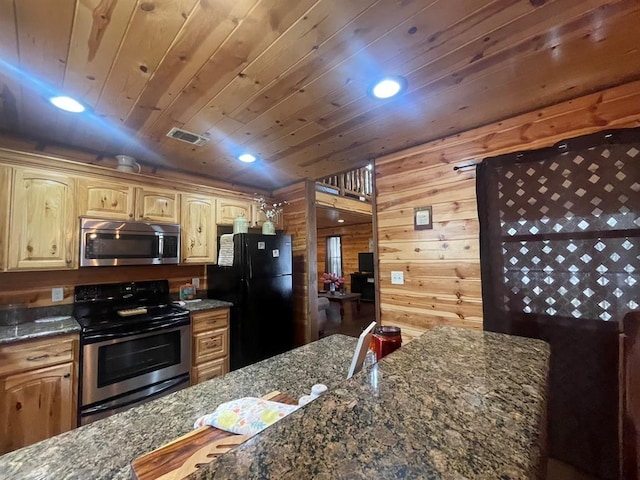 kitchen featuring visible vents, wooden walls, wood ceiling, dark stone countertops, and stainless steel appliances