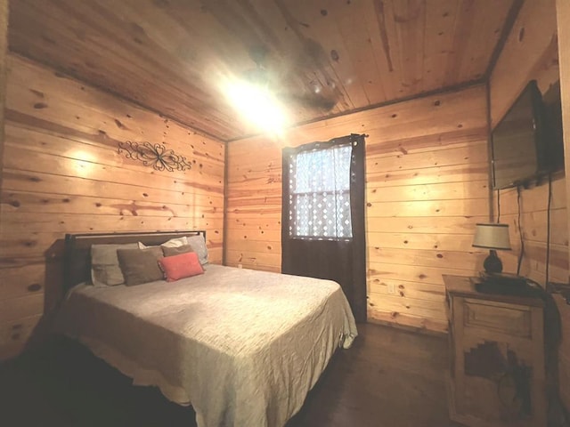 bedroom featuring wooden walls and wood ceiling