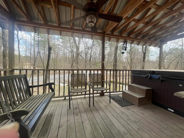 wooden deck with a hot tub