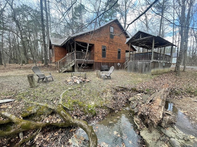 exterior space featuring log veneer siding