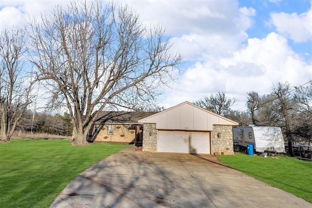 ranch-style house featuring a front lawn, an attached garage, board and batten siding, and concrete driveway