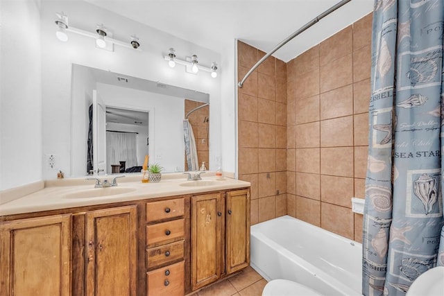 full bath with tile patterned flooring, double vanity, shower / bathtub combination with curtain, and a sink