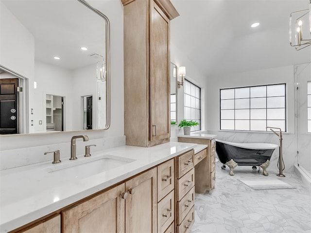 bathroom featuring vanity, a soaking tub, recessed lighting, and marble finish floor