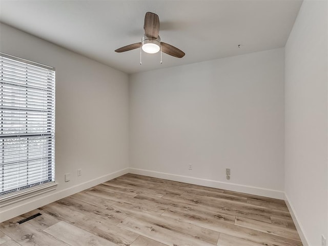 unfurnished room with light wood-style floors, baseboards, and ceiling fan