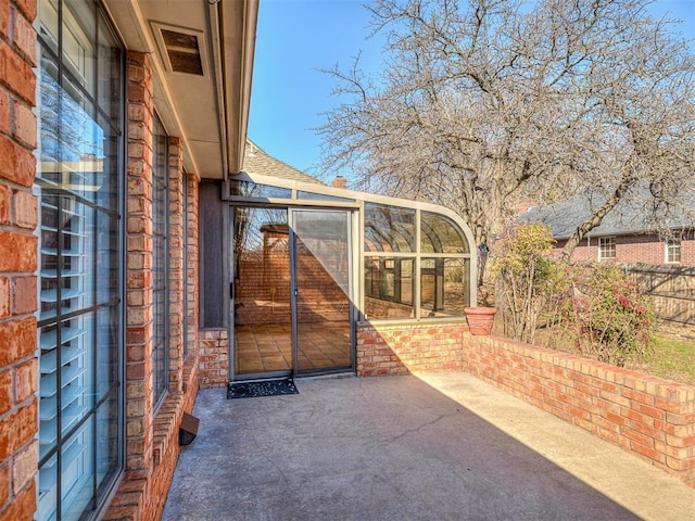 view of patio featuring fence