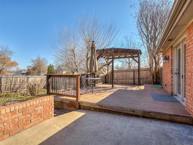 wooden terrace with a pergola and a fenced backyard