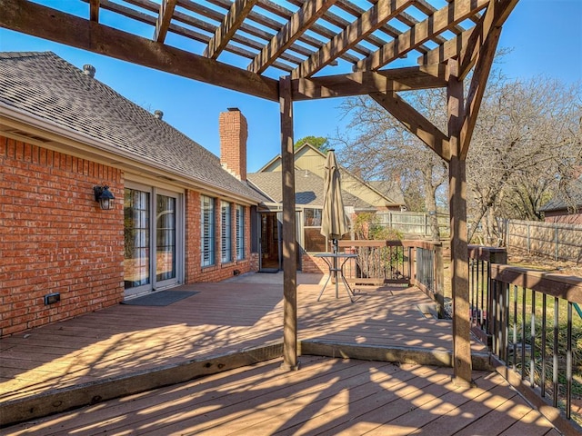 wooden terrace with fence and a pergola