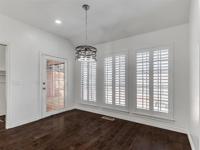 2809 Red Fern, Edmond, OK 73034 - unfurnished dining area featuring a chandelier, dark wood finished floors, and vaulted ceiling