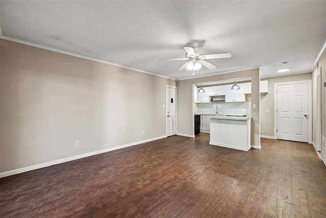 unfurnished living room with dark wood-type flooring, crown molding, and ceiling fan