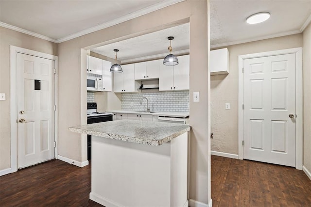 kitchen featuring a sink, range with electric stovetop, white cabinetry, light countertops, and white microwave